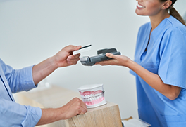 Dental patient swiping their payment card