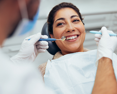 Woman smiling at her dentist during a dental checkup