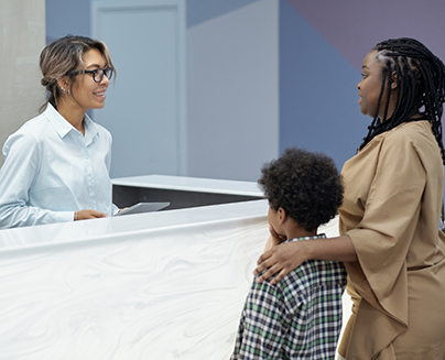 Mother and child checking in at dental office