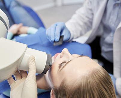 Dental patient having x rays taken of her mouth and jaws