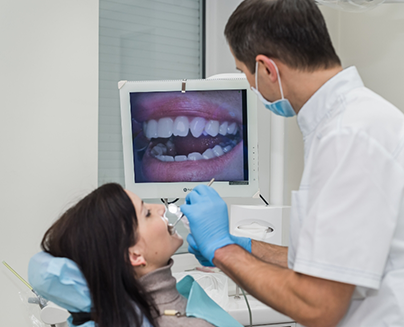 Dentist taking close up photos of a patients teeth