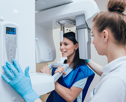 Dental patient getting a C T scan taken of her mouth and jaws