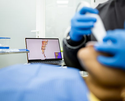 Dentist capturing digital scans of a patients teeth