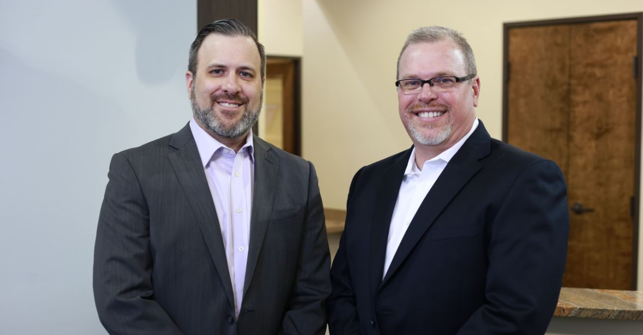 Cleburne dentists Doctor Chris Long and Doctor Robert Long smiling