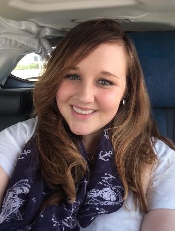 Selfie of a young woman sitting in a car