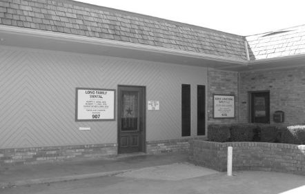 Black and white photo of old Long Family Dental of Cleburne office building