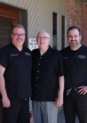 Cleburne dentist Doctor Henry Long with his sons Doctor Bob Long and Doctor Chris Long /><span class=