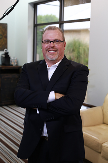 Cleburne dentist Doctor Robert Long smiling in a suit