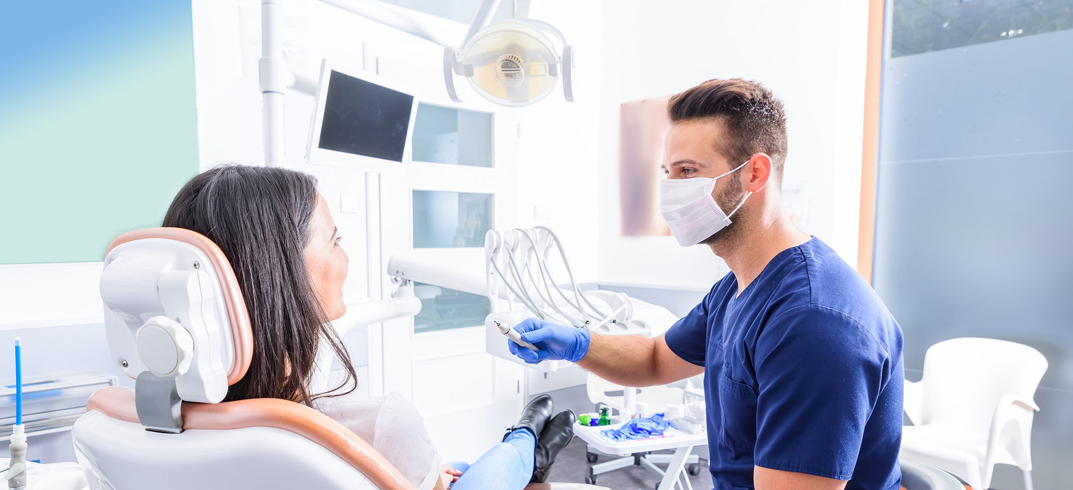 Woman in dental chair talking calmly to her sedation dentist in Cleburne