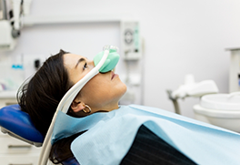 Dental patient with a nitrous oxide mask on their nose