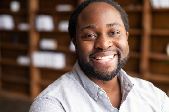 man smiling after getting dental implants 